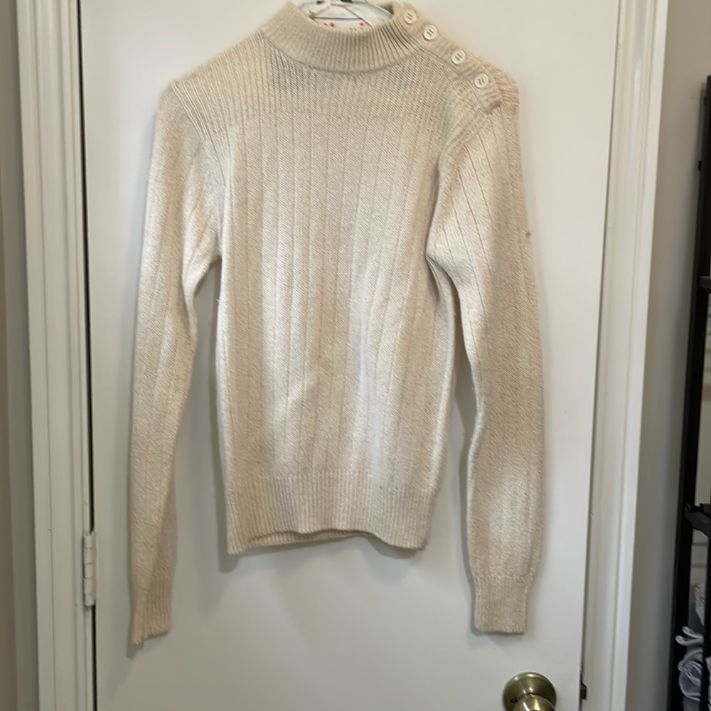 Silk, angora, acrylic and nylon. Looks small for a size L. Button neck. Vintage